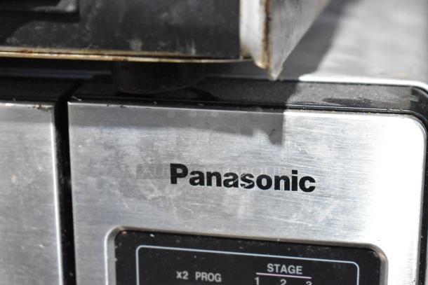 Panasonic NE-1054F stainless steel commercial microwave, visible model label. Used condition, 120V, 1-phase.