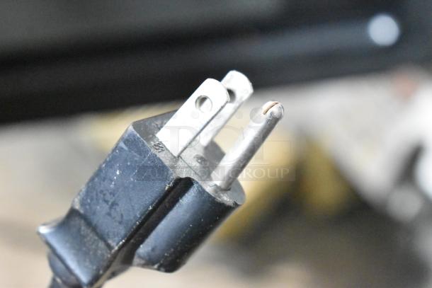 Power plug of Panasonic NE-1054F Commercial Microwave Oven, showing a standard three-prong design.