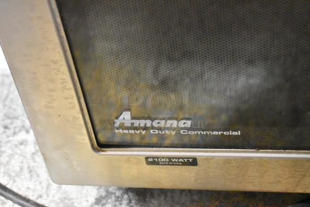 Amana HDC21 stainless steel commercial microwave oven, 2100 watts, labeled "Heavy Duty Commercial," 208/230 volts, 1 phase.