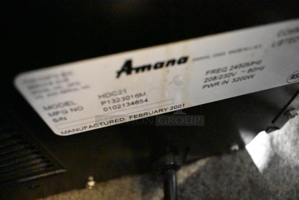 Amana HDC21 stainless steel commercial countertop microwave, model number and specs shown. Manufactured February 2001.