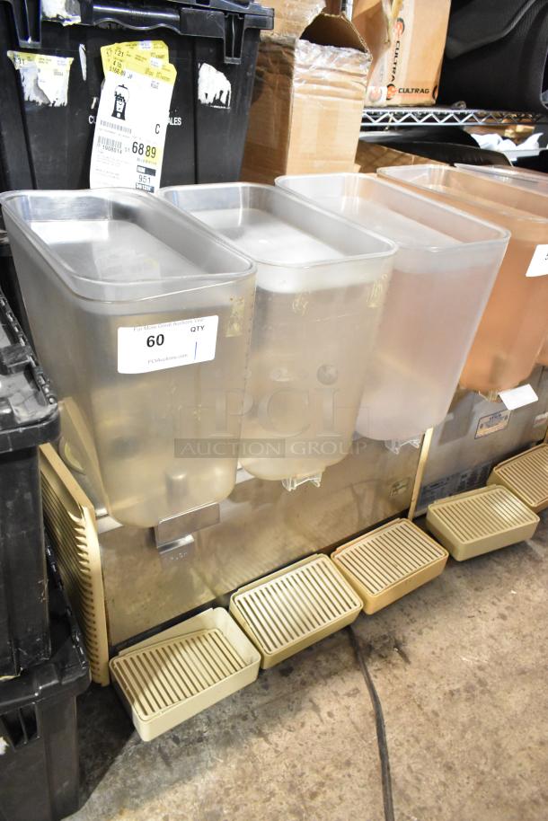 Crathco D35-4 commercial beverage machine with three hoppers, metal body, 115 volts, 1 phase. Marked with auction tag.