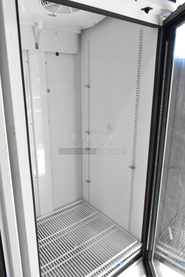 2021 True TSCI-600R-G-PH single door cooler merchandiser, metal, poly-coated racks, 115V, excellent condition.