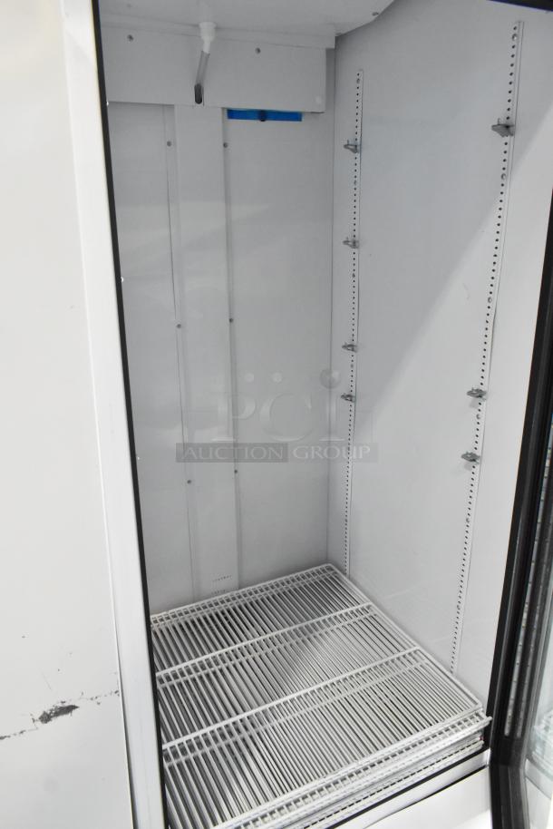 2020 True TSCI-600R-G-PH single door cooler with poly-coated racks, 115V, 1 Phase. Interior view, excellent condition.