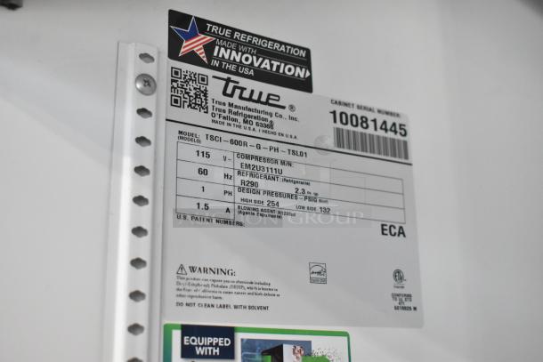 Label close-up of True TSCI-600R-G-PH commercial cooler, showing model, voltage, phase, refrigerant details, and serial number.