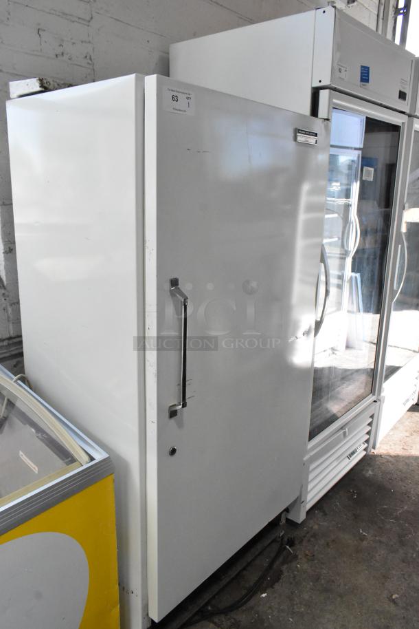 Sears Coldspot metal single-door reach-in freezer, 115V, 1 phase, in fair condition with minor surface scratches.