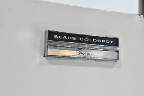 Sears Coldspot single door freezer, metal exterior, 115 volts, 1 phase. Features "Freezer" label on door.