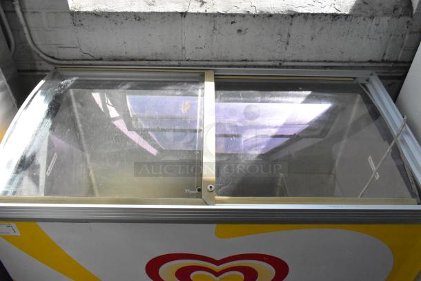 Caravell 406-995 metal chest freezer merchandiser, glass top, 115 volts, 1 phase, visible logo, fair condition.