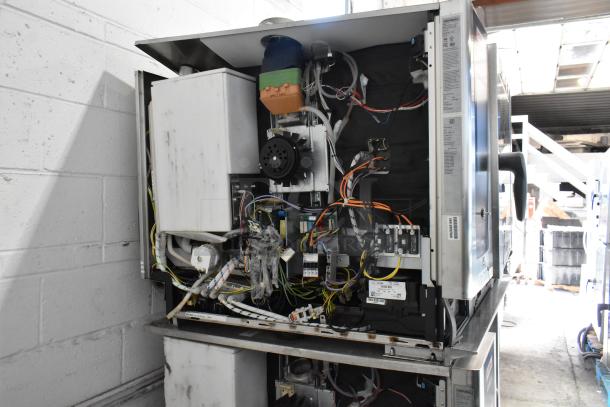 Two 2021 Rational iCombiPro stainless steel electric convection ovens, model LM100CE.AXXXX/LM100EE.AXXXX, 440/480V, 3 Phase, internal wiring visible.
