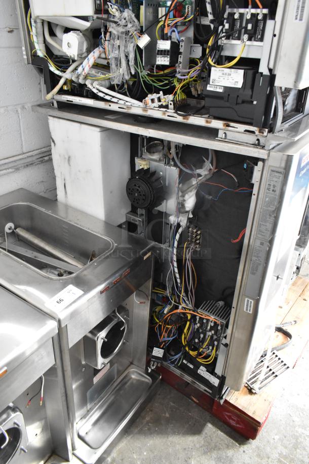 Rational iCombiPro LM100CE.AXXXX/LM100EE.AXXXX convection ovens, stainless steel, electric, open panel view showing internal wiring.