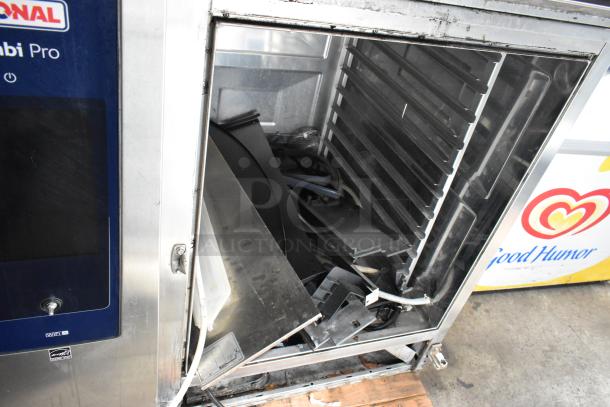 Rational iCombiPro stainless steel convection oven, electric-powered, 440/480V, 3 phase. Interior shows signs of disassembly.