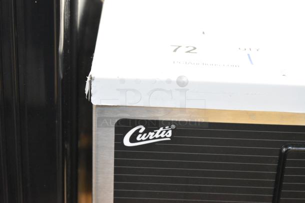 Curtis D1000GT63A000 stainless steel commercial double coffee machine with hot water dispenser, label visible, new condition.