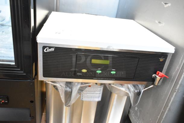 Curtis D1000GT63A000 stainless steel commercial coffee machine with hot water dispenser, 2 metal brew baskets, 120/220V.
