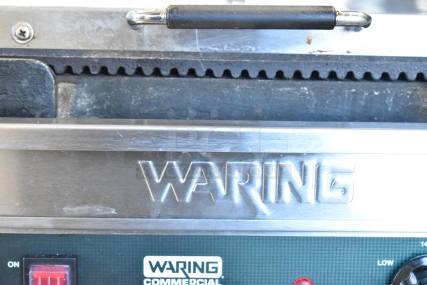 Waring WDG250 stainless steel commercial panini press, 120 volts, 1 phase, visible branding, used condition.