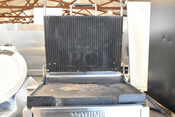Waring WDG250 stainless steel panini press, open with visible grill plates. 120 volts, 1 phase. Used condition.