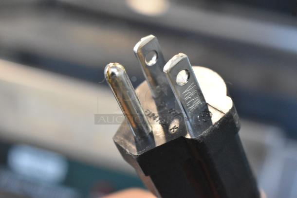 Close-up of plug for Waring WDG250 Panini Press, 120V, 1 Phase. Stainless steel commercial countertop model.