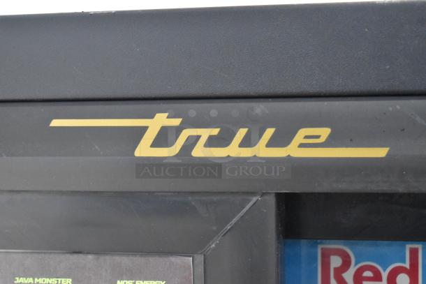 True GDM-41SL-60-LD metal 2-door reach-in cooler, yellow logo, poly-coated racks, 115 volts, 1 phase.
