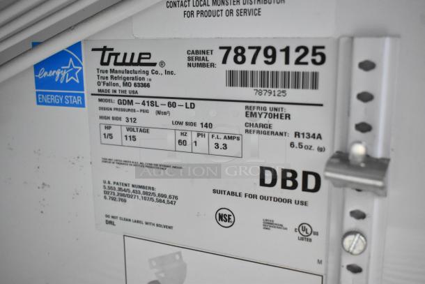 True GDM-41SL-60-LD cooler label showing model info, Energy Star rating, 115 volts, 1 phase, suitable for outdoor use.
