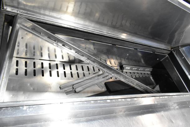 Turbo Air TPR-67SD-D4 stainless steel commercial pizza prep table interior, showing metal components and drawer guides.