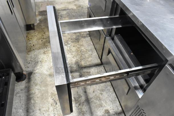 Turbo Air TPR-67SD-D4 stainless steel pizza prep table with 4 drawers, open drawer view; commercial use, 115V, 1 Phase.