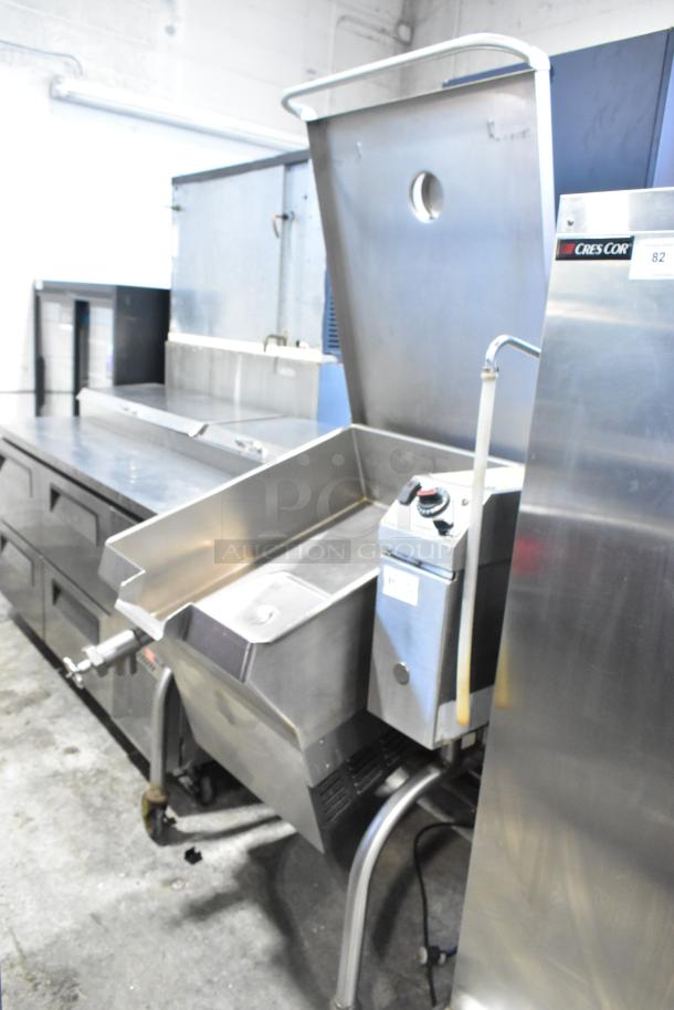 Cleveland Metal Commercial Tilting Braising Pan, stainless steel, equipped with control panel and spout, in a commercial kitchen setting.