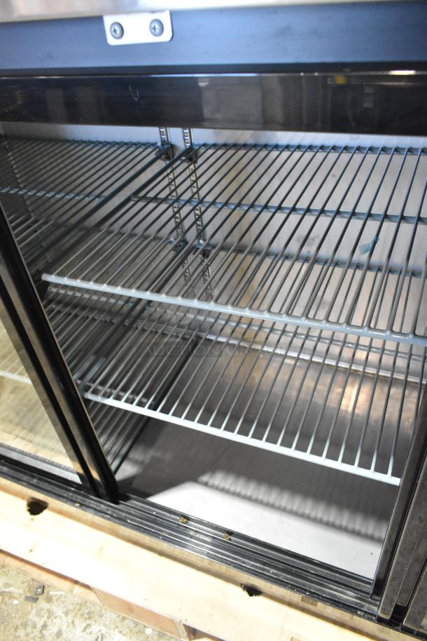2025 Avantco 178UBB72SHC 73" black counter height back bar refrigerator, sliding glass door, LED lighting, excellent condition.