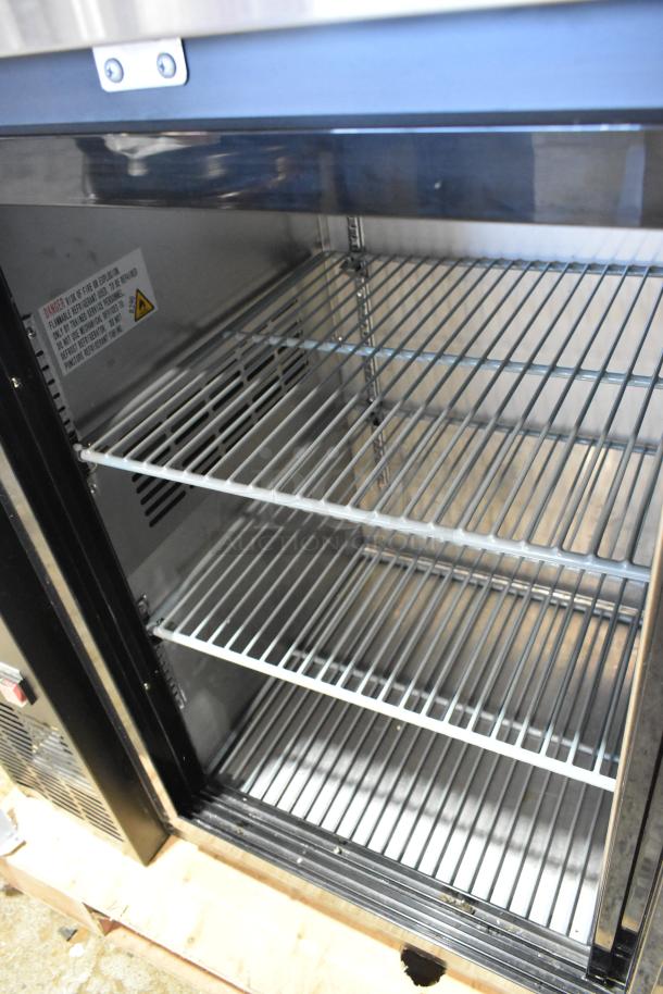 73" Avantco 178UBB72SHC back bar refrigerator with sliding glass door, LED lighting, three shelves. Black finish, excellent condition.