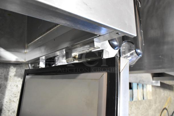 Beverage Air UCR48A stainless steel, 2-door undercounter cooler, shown with door open. Commercial casters visible.