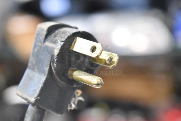 Close-up of a power plug for the Beverage Air UCR48A cooler; shows standard 115-volt compatibility.