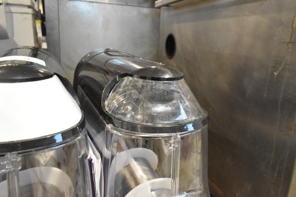 Stoelting SCBF128-37 metal commercial frozen beverage machine with dual 2.6-gallon tanks, 115 volts, black and clear design.