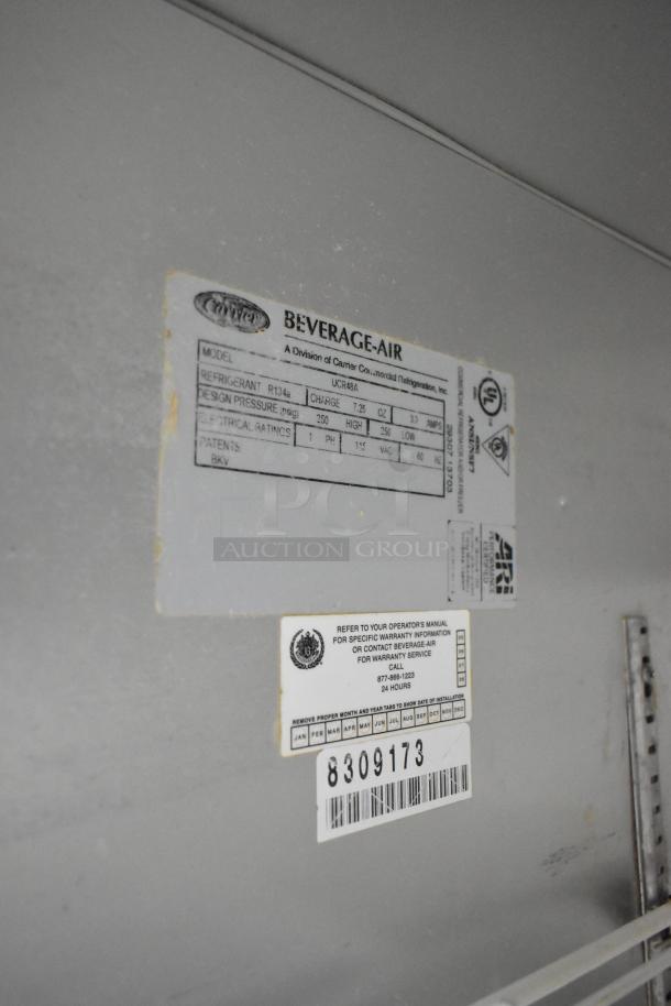 Beverage Air UCR48A stainless steel undercounter cooler with two doors, model and service labels visible, on casters, 115V.