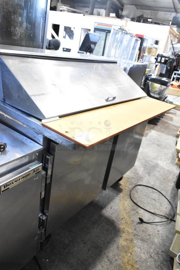 Beverage Air stainless steel sandwich prep table, mega top, on commercial casters; 115V, 1 phase, good condition.