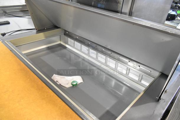 Beverage Air stainless steel sandwich salad prep table with mega top and commercial casters. 115 volts, 1 phase.