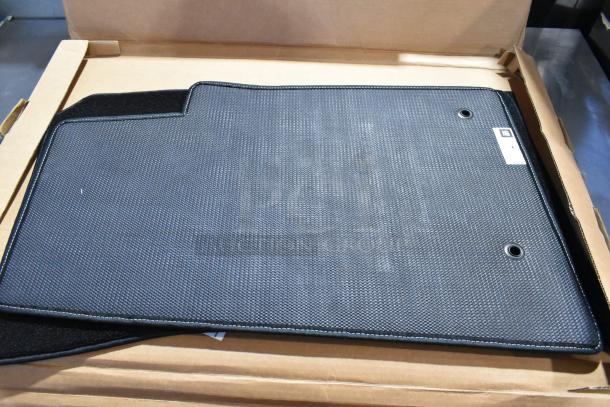 Brand new Lloyd Mats car mat, black with textured finish, in original packaging. Features mounting holes and label.
