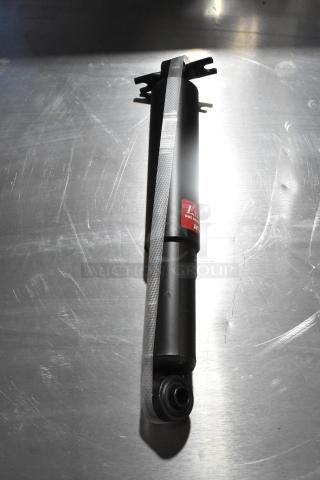 Brand new KYB 344403 Excel G Gas Shock Absorber; minor scratches, tags visible; high-performance automotive part.