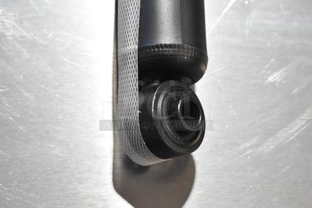 Brand new KYB 344403 Excel G gas shock absorber, scratch and dent condition, close-up of mounting end.