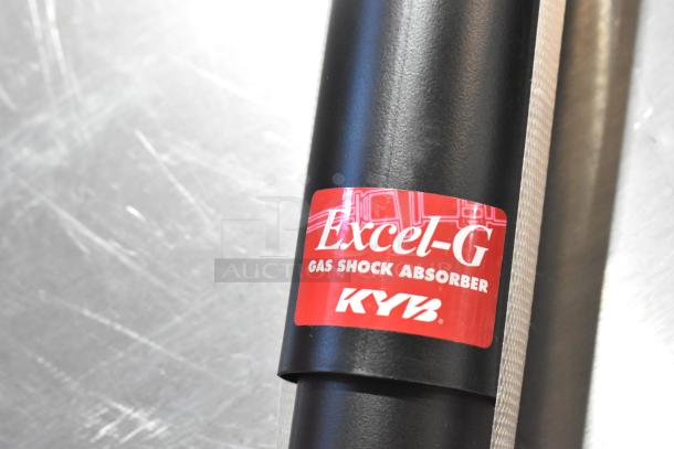 Brand new KYB 344403 Excel G Gas Shock Absorber, labeled with red "Excel-G" and "KYB," scratch and dent condition.