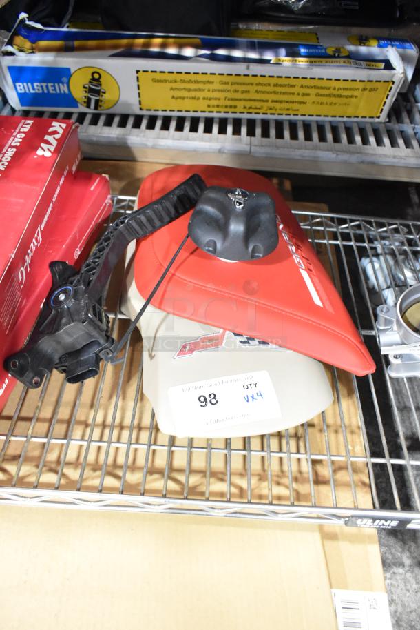 Four assorted items including a red Grand Sport pad on a metal shelf. Features a label indicating "QTY 4" and item number 98.