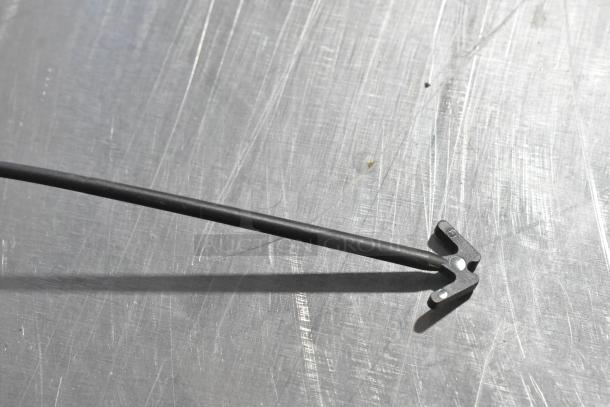 Four-item auction, includes Grand Sport Pad. Metal rod shown, scratches visible, sturdy condition. Bid multiplies by four.