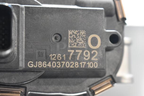 GM metal unit with model number 12617792 and code GJ86403702817100, featuring QR code marking.