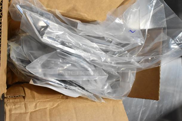 Box containing GM metal part, sealed in plastic for protection. Auction includes two items, doubling bid value.