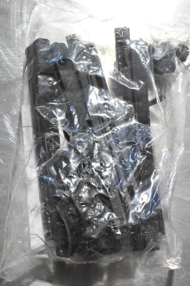 Sealed plastic bag containing GM metal parts, unclear specifics. Potentially valuable for automotive use.