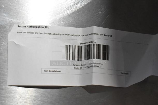 Alt text: Return authorization slip with barcode and Amazon return details, on metallic background.