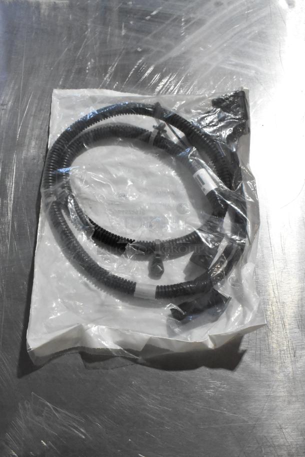 Plastic-wrapped gear kit with coiled hose, sealed in original packaging. Includes oil additive, oil seal. New condition.