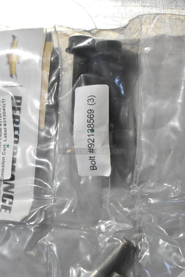 Clear plastic bag with bolts labeled "Bolt #92138569 (3)," part of a gear kit. Chevrolet Performance logo visible.