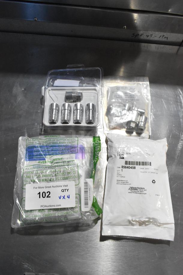 Four sets of hubcap bolt kits in original packaging, includes various bolts. Labels show part numbers and quantity.