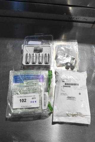 Four sets of hubcap bolt kits in original packaging, includes various bolts. Labels show part numbers and quantity.