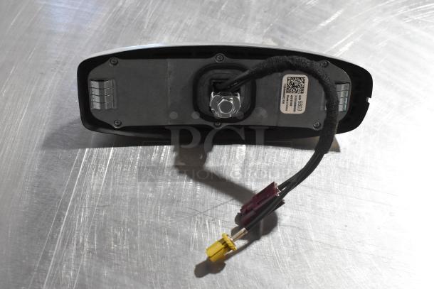Rear-view mirror with attached wires, QR code label visible. Part of a 3-item auction bundle including a vent and license plate frame.