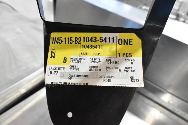 Black license plate frame with yellow and white label. Label shows work assignment 4770295, order 8501388, and pick weight 0.27.