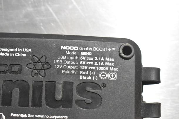 NOCO Genius Boost GB40 jump starter, USB input/output 5V 2.1A, 12V output 1000A max, polarity marked, designed in USA.