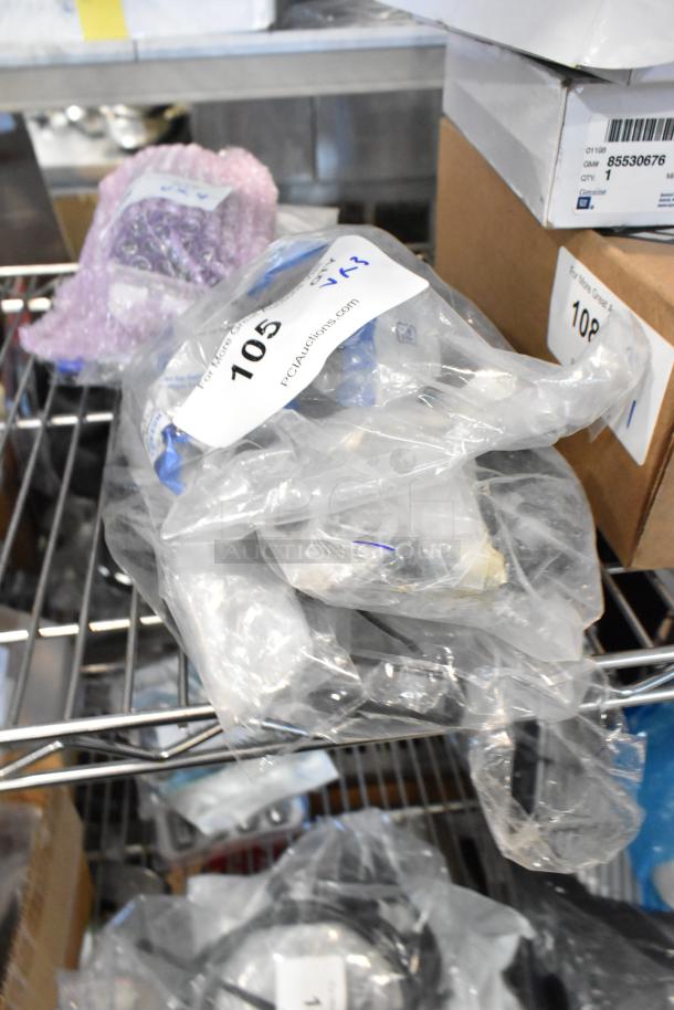 Three packaged items including wire, labeled with auction lot number 105. Items appear new in plastic wrapping.
